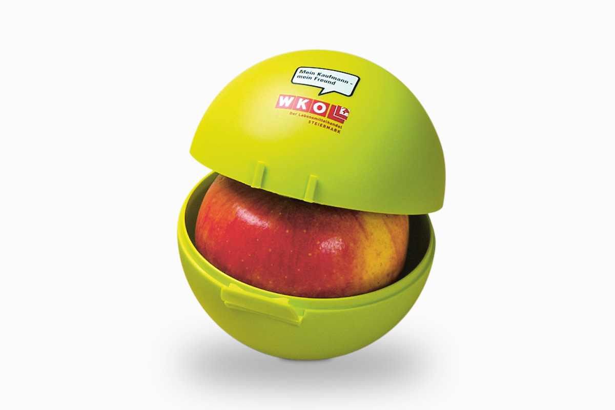 Abgebildet ist eine nachhaltige grüne Apfelbox in passender Form.